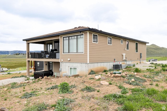 207 E Clubhouse Dr Unit 40, Garden City, UT 84028 - view of side of home with a hot tub, a mountain view, and cooling unit