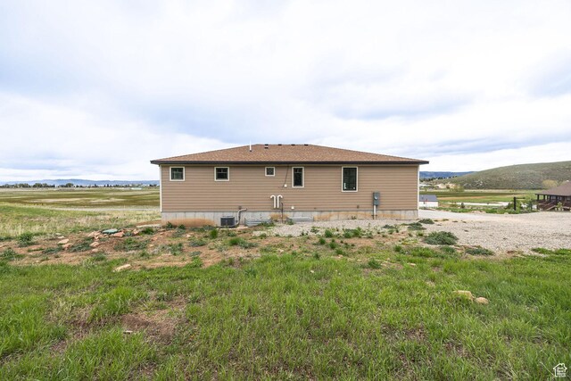 207 E Clubhouse Dr Unit 40, Garden City, UT 84028 - back of property featuring central AC and a view of countryside