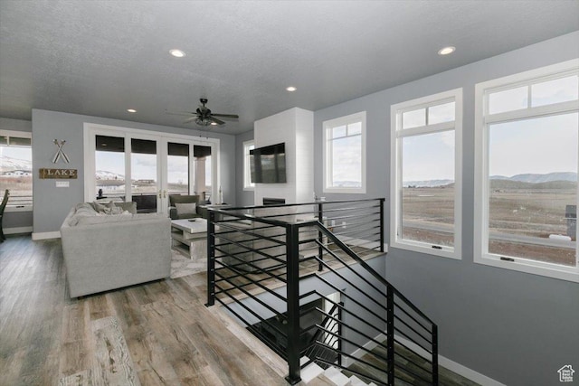 207 E Clubhouse Dr Unit 40, Garden City, UT 84028 - living room featuring baseboards, healthy amount of natural light, recessed lighting, and wood finished floors