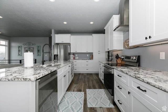 207 E Clubhouse Dr Unit 40, Garden City, UT 84028 - kitchen with appliances with stainless steel finishes, a sink, wall chimney range hood, dark wood-type flooring, and recessed lighting