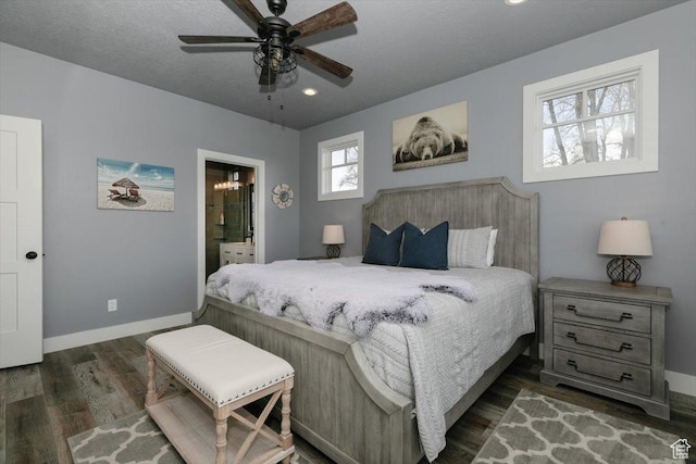 207 E Clubhouse Dr Unit 40, Garden City, UT 84028 - bedroom with dark wood finished floors, baseboards, recessed lighting, connected bathroom, and ceiling fan