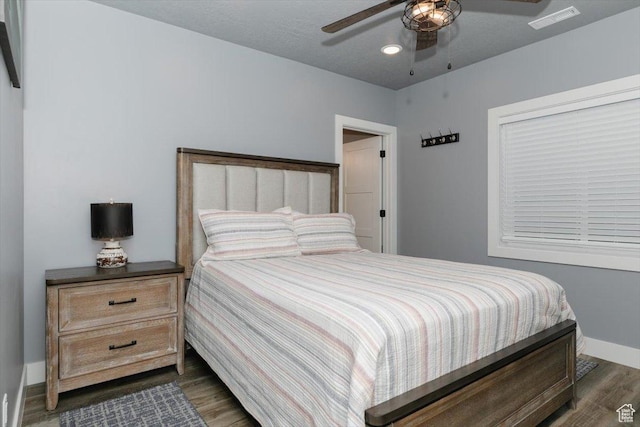207 E Clubhouse Dr Unit 40, Garden City, UT 84028 - bedroom with dark wood-type flooring, baseboards, and a ceiling fan