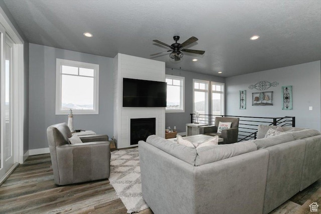 207 E Clubhouse Dr Unit 40, Garden City, UT 84028 - living area with ceiling fan, wood finished floors, baseboards, a fireplace, and recessed lighting