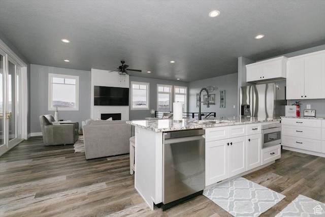 207 E Clubhouse Dr Unit 40, Garden City, UT 84028 - kitchen featuring appliances with stainless steel finishes, a sink, recessed lighting, an island with sink, and ceiling fan