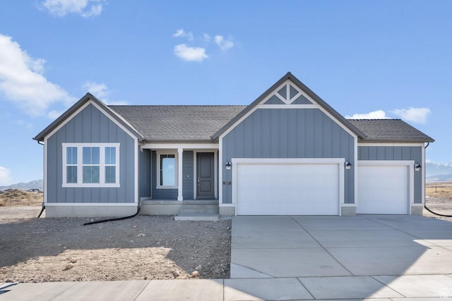 view of front of property with a porch, board and batten siding, driveway, an attached garage, and a shingled roof