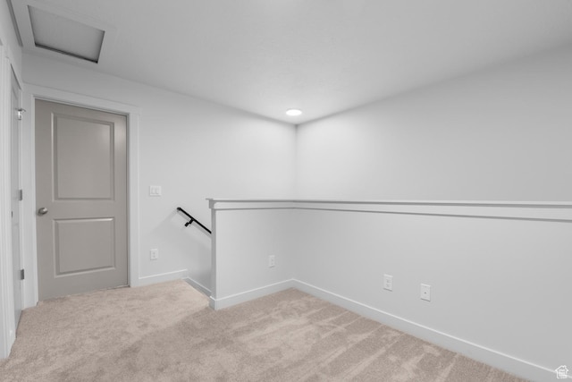 unfurnished room featuring baseboards and carpet flooring