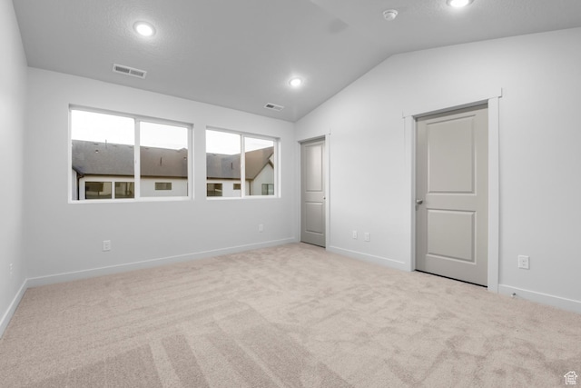unfurnished bedroom featuring recessed lighting, baseboards, visible vents, and lofted ceiling