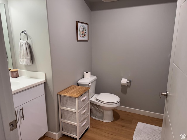 675 S 100 W Unit A203, Springville, UT 84663 - half bath featuring vanity, baseboards, wood finished floors, and toilet
