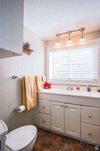 bathroom with vanity and toilet