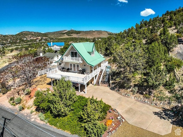 birds eye view of property with a mountain view