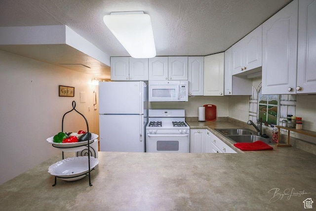 kitchen featuring a sink, a textured ceiling, white appliances, and white cabinetry