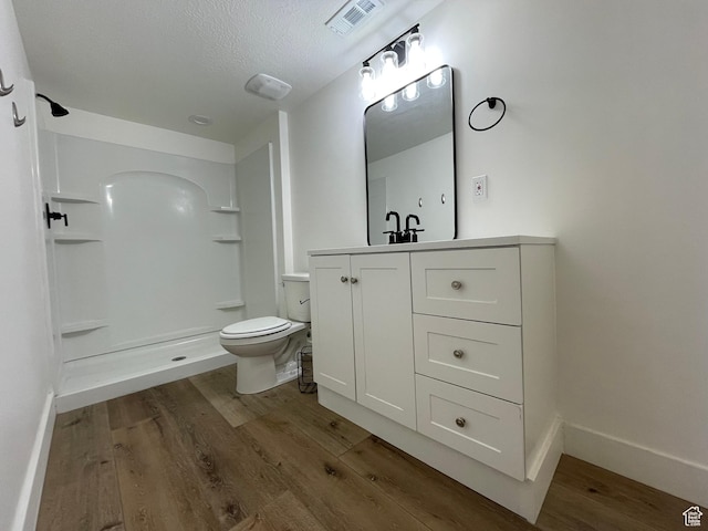 3834 N 2550 W, Farr West, UT 84404 - full bathroom with wood finished floors, vanity, and a shower