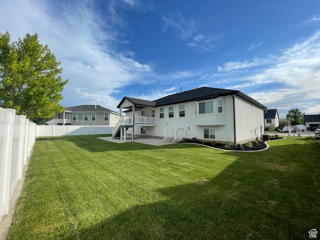 3834 N 2550 W, Farr West, UT 84404 - back of house with central air condition unit and a patio
