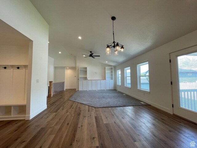 3834 N 2550 W, Farr West, UT 84404 - unfurnished living room featuring a chandelier, hardwood / wood-style floors, vaulted ceiling, ceiling fan, and recessed lighting