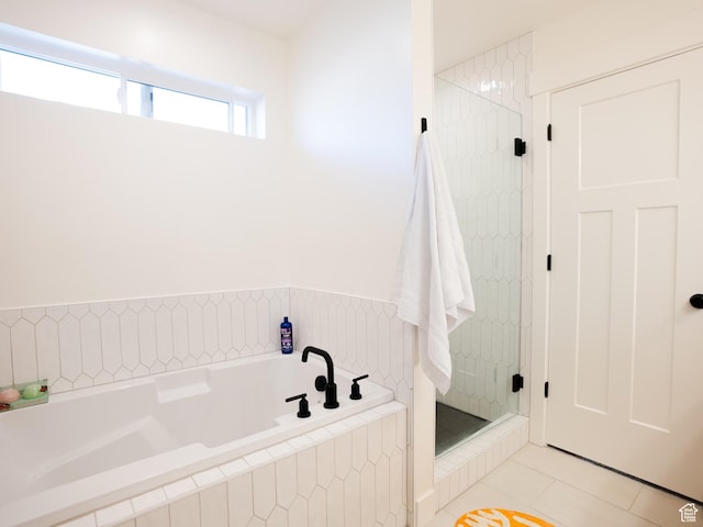 3834 N 2550 W, Farr West, UT 84404 - bathroom featuring tile patterned floors, a bath, and a stall shower
