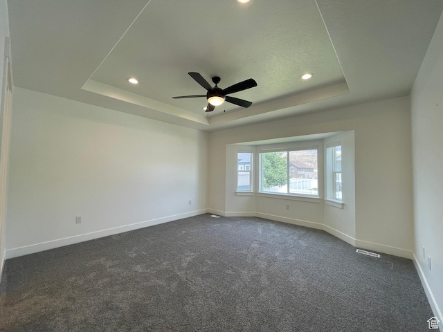 3834 N 2550 W, Farr West, UT 84404 - empty room with a tray ceiling, recessed lighting, a ceiling fan, and dark colored carpet