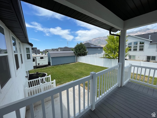 3834 N 2550 W, Farr West, UT 84404 - wooden terrace featuring a mountain view, a residential view, and a shed