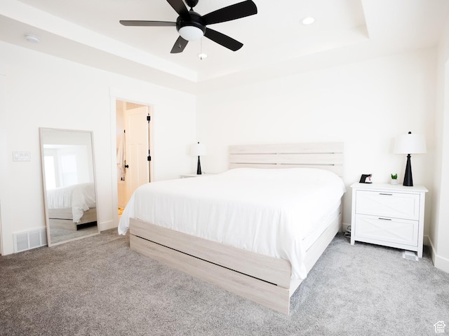 3834 N 2550 W, Farr West, UT 84404 - bedroom with visible vents, a tray ceiling, ceiling fan, and light colored carpet