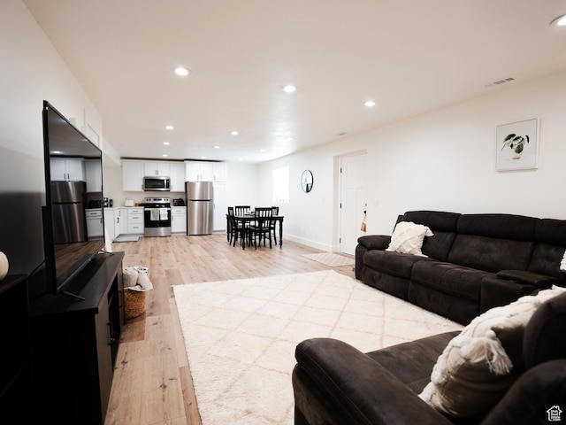 3834 N 2550 W, Farr West, UT 84404 - living area featuring baseboards, recessed lighting, light wood-style flooring, and visible vents