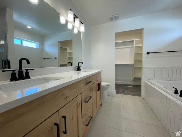 3834 N 2550 W, Farr West, UT 84404 - bathroom with double vanity, a walk in closet, a garden tub, and tile patterned floors