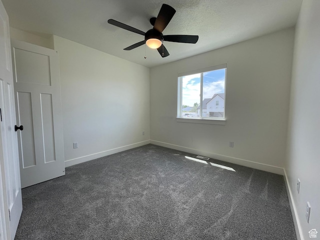 3834 N 2550 W, Farr West, UT 84404 - spare room with dark colored carpet and a ceiling fan