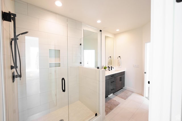 7093 W Granbury Dr S Unit 255, South Jordan, UT 84009 - bathroom with vanity, tile patterned flooring, a stall shower, and recessed lighting