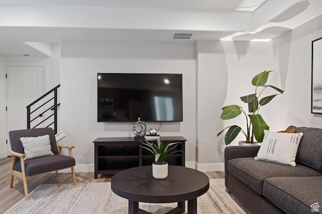 7093 W Granbury Dr S Unit 255, South Jordan, UT 84009 - living room with baseboards, visible vents, and light wood-style flooring