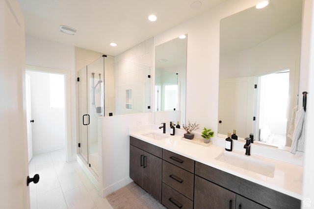 7093 W Granbury Dr S Unit 255, South Jordan, UT 84009 - ensuite bathroom featuring a sink, tile patterned flooring, a shower stall, and double vanity