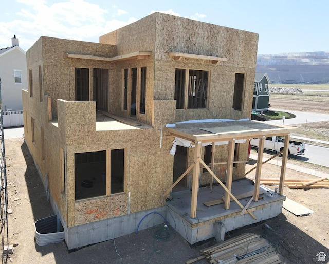 back of house featuring stucco siding