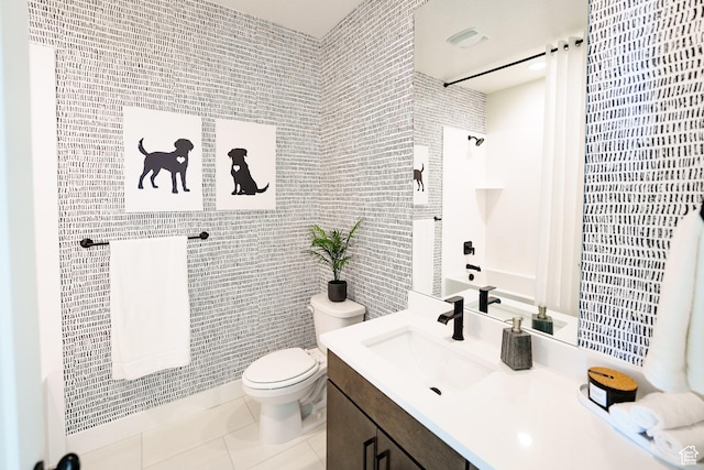 7093 W Granbury Dr S Unit 255, South Jordan, UT 84009 - full bathroom featuring tile walls, tile patterned flooring, vanity, and toilet
