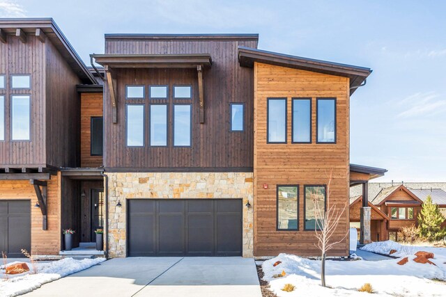 359 N Abajo Peak Loop E Unit A3, Heber City, UT 84032 - contemporary home with concrete driveway, an attached garage, and stone siding