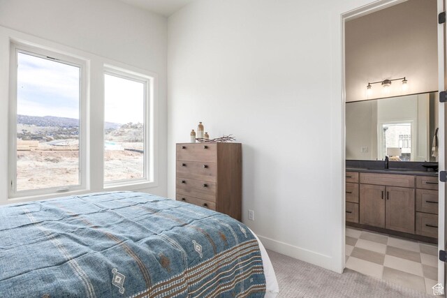359 N Abajo Peak Loop E Unit A3, Heber City, UT 84032 - bedroom with light carpet, baseboards, light floors, a sink, and ensuite bath