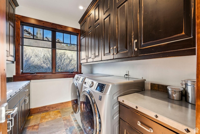 2042 Paddington Dr, Park City, UT 84060 - washroom featuring baseboards, stone finish flooring, cabinet space, and washer and clothes dryer