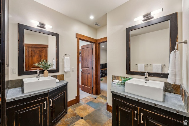 2042 Paddington Dr, Park City, UT 84060 - bathroom with a sink, two vanities, baseboards, and visible vents