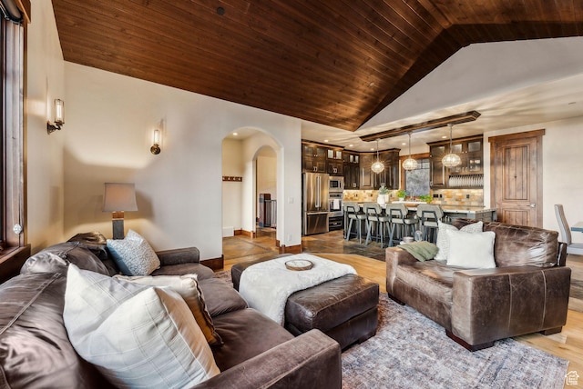 2042 Paddington Dr, Park City, UT 84060 - living room with lofted ceiling, wood ceiling, arched walkways, and wood finished floors