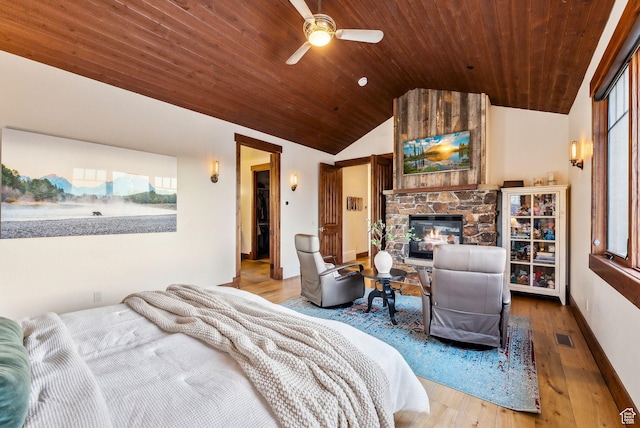 2042 Paddington Dr, Park City, UT 84060 - bedroom featuring vaulted ceiling, wooden ceiling, a stone fireplace, visible vents, and wood finished floors