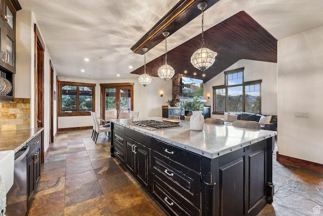 2042 Paddington Dr, Park City, UT 84060 - kitchen featuring dark cabinetry, a notable chandelier, baseboards, and stone tile flooring