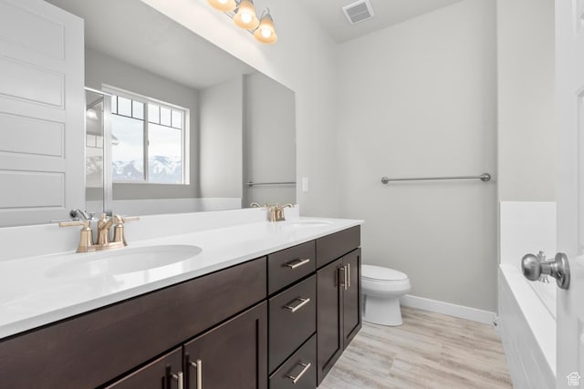 674 W Junegrass Ln, Stansbury Park, UT 84074 - full bathroom with a sink, a garden tub, double vanity, and visible vents