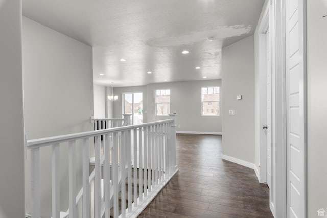674 W Junegrass Ln, Stansbury Park, UT 84074 - hallway with recessed lighting, dark wood finished floors, baseboards, and an upstairs landing
