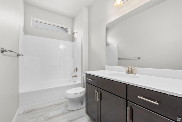 674 W Junegrass Ln, Stansbury Park, UT 84074 - bathroom featuring vanity, toilet, wood finished floors, and tub / shower combination