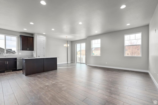 674 W Junegrass Ln, Stansbury Park, UT 84074 - kitchen with recessed lighting, open floor plan, a notable chandelier, and a kitchen island