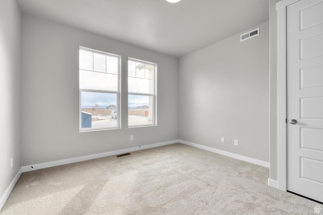 674 W Junegrass Ln, Stansbury Park, UT 84074 - carpeted empty room with visible vents and baseboards