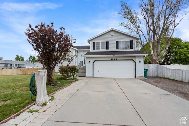 traditional home featuring a garage, a front lawn, fence, and driveway