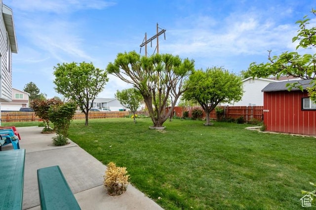 3184 W 5025 S, Roy, UT 84067 - view of yard with an outbuilding, a fenced backyard, and a patio area