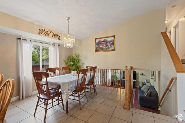 3184 W 5025 S, Roy, UT 84067 - tiled dining space featuring baseboards, vaulted ceiling, and a chandelier
