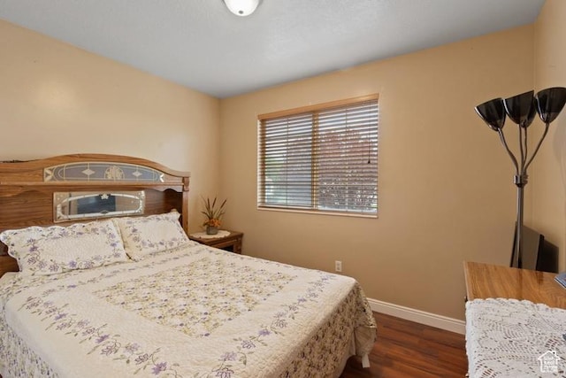 3184 W 5025 S, Roy, UT 84067 - bedroom with baseboards and dark wood-type flooring