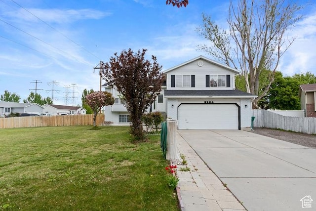 3184 W 5025 S, Roy, UT 84067 - traditional-style home featuring an attached garage, a front lawn, fence, and concrete driveway