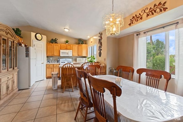 3184 W 5025 S, Roy, UT 84067 - dining area with light tile patterned flooring, vaulted ceiling, and an inviting chandelier