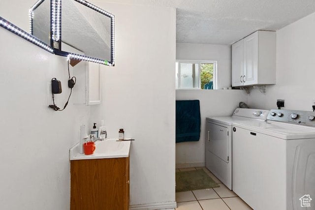 3184 W 5025 S, Roy, UT 84067 - laundry room featuring a sink, cabinet space, light tile patterned floors, and washer and dryer