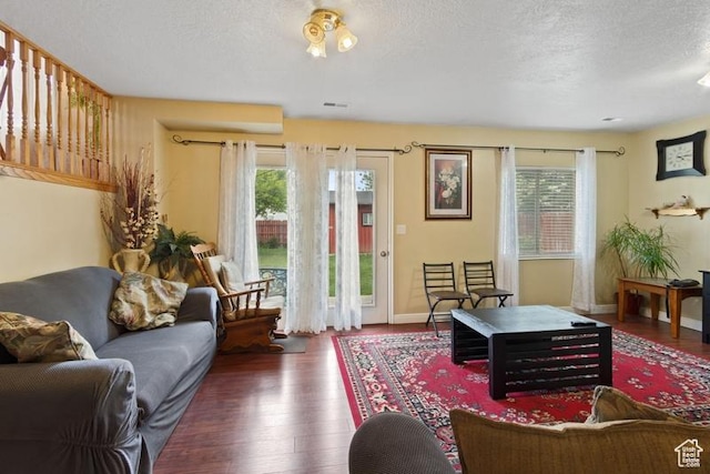 3184 W 5025 S, Roy, UT 84067 - living room with a textured ceiling, baseboards, wood finished floors, and a wealth of natural light